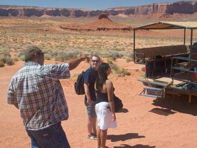 Tour Guide points to visitors from the Netherlands but misses (he's better at pointing to big things like Monuments)