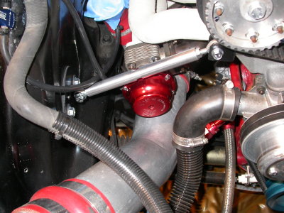 Engine brace on passenger side, shown with turbo discharge removed.