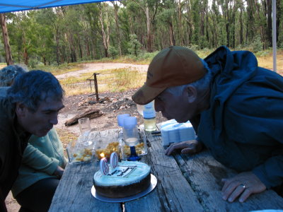 Macca and Parso blowing out the candles.
