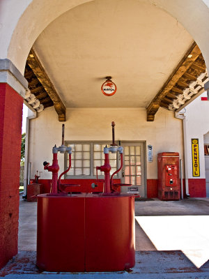 A closeup of the archway with mobil gas globe and oil pumps.