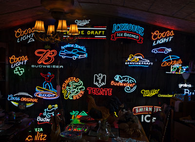 A wall of neon signs for sale, Wimberly, TX