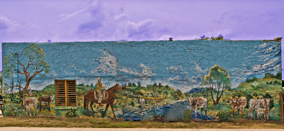 This mural is painted on the side wall of the Kemp-fire Barbecue in Kempner, TX.