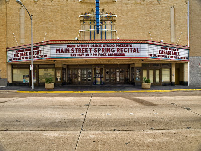 A long shot of the theater entrance and marquee