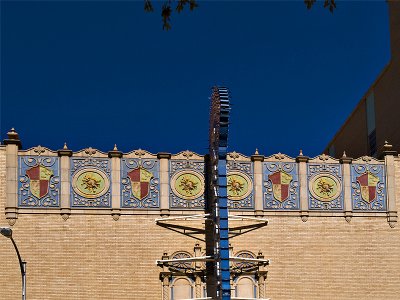 The artwork at  the top of the theater facade