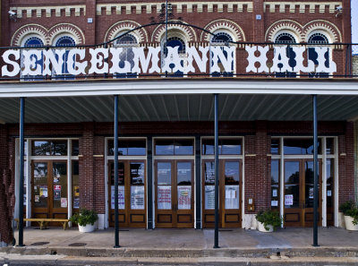 A closeup of the hall sign and entrance.