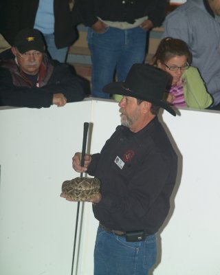 NEVER DO THIS AT HOME- YES THAT IS A LIVE RATTLESNAKE COILED IN HIS HAND