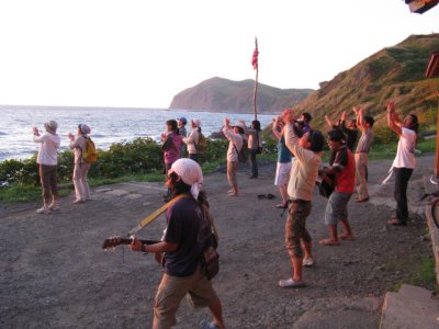 Visitors at the youth hostel gather to sing & dance to the sunset. There were group sing alongs and dancing until 10:00 p.m.