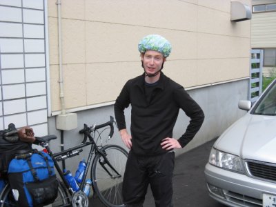 Day 18: Korey is all ready for the expected rain. There was light rain until Sapporo; dry thereafter.