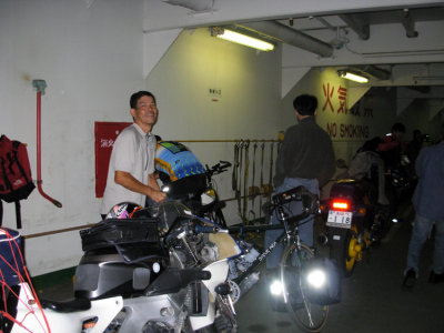 In the belly of the ferry. Bike are tied along the side.