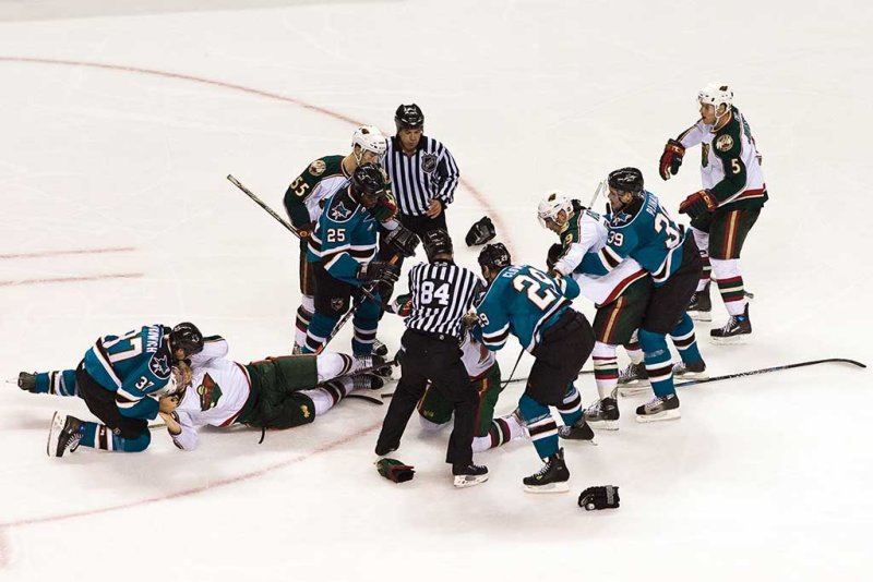 Scrum caused by Ryane Clowe on Cal Clutterbuck after a check to Dan Boyle