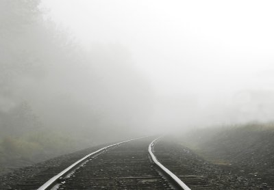 traintracks disappearing into the mist