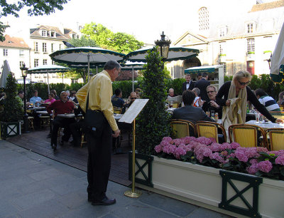 Checking the menu at Deux Magots.jpg