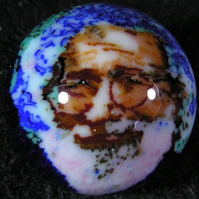 0.90 One of Chris' cane style marbles, also done on the sphere grinder, using a chunk of Jerry Garcia cane.