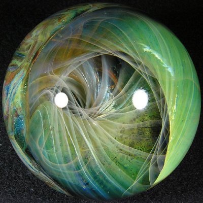 This is another of those fantastic Yaun marbles with the twisting silver fume over the gold!