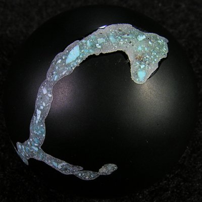 Bryan inlaid real turquoise into the glass, and then tumbled and polished the marble to gve it a matte finish.