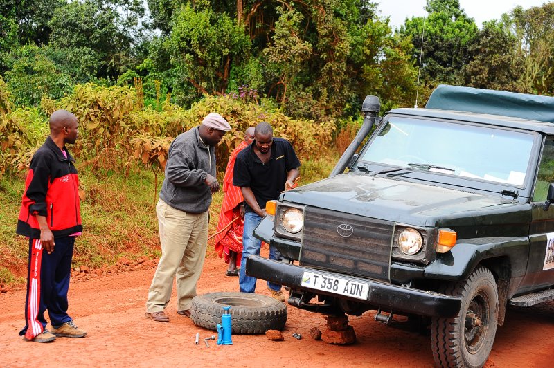 Duncan & Moody help change the flat tire