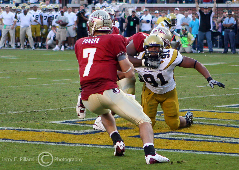Jackets DE Morgan gets taken to the ground as he pursues Noles QB Ponder in the FSU end zone