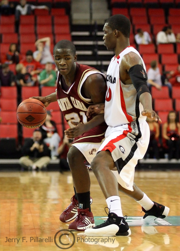 Bulldogs G Woodbury defends Broncos G Foster on the perimeter