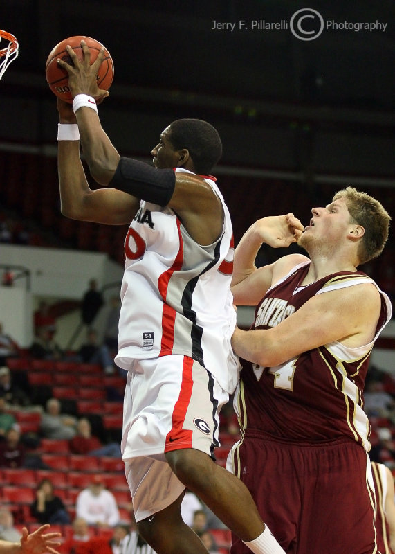 Bulldogs G Woodbury moves around Broncos C Bryant for the basket