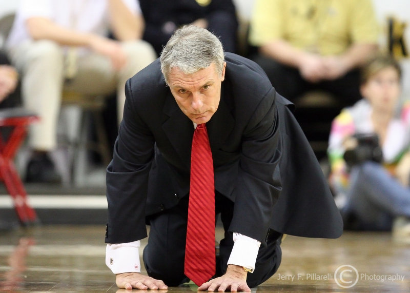 Maryland Terrapins Head Coach Gary Williams collapses to the floor to show his dismay over the play of his team