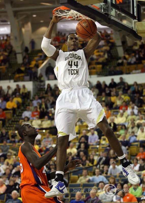 Tech F Aminu slam dunks the ball off of a breakaway