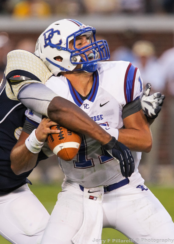 Yellow Jackets DE Crenshaw hits Blue Hose QB Garrick as he attempts to pass