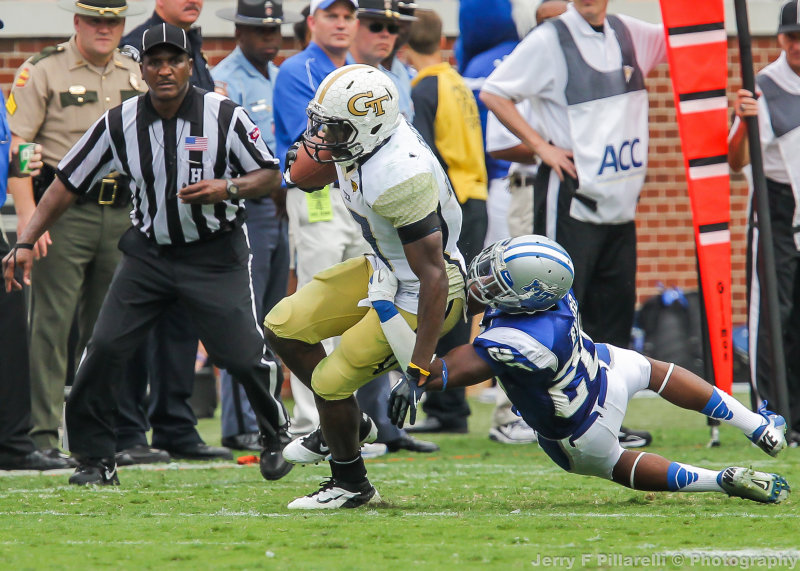 Georgia Tech A-back Smith is brought down along the sidelines by Middle Tennessee State S Byard