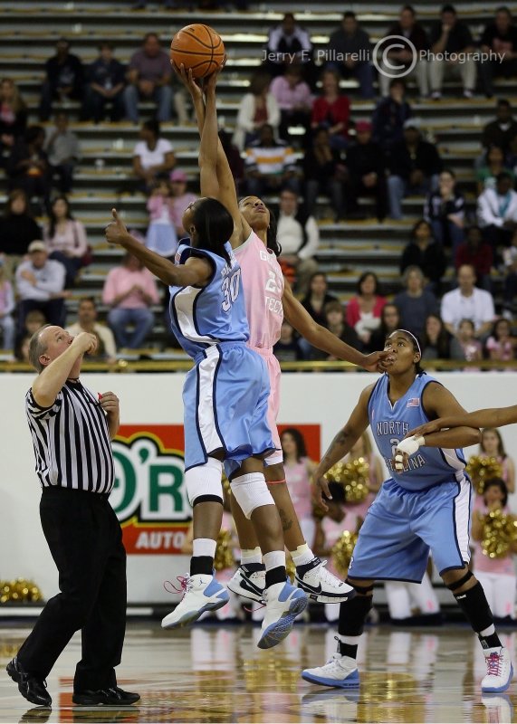 Tip-off between Jackets F Alex Montgomery and Tar Heels F LaToya Pringle
