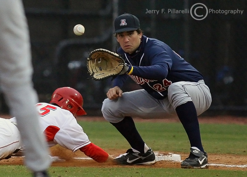 Wildcats 1B Ziegler takes the pick-off throw as Bulldogs 2B Demperio dives back safely