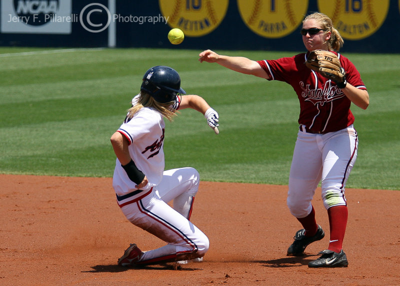 Arizona DP Stacie Chambers attempts to disrupt the throw of Stanford IF Shannon Koplitz