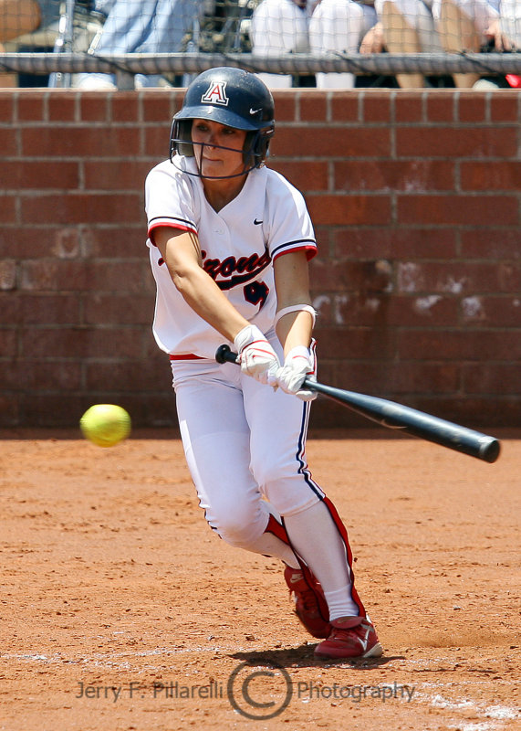 Arizona Wildcat CF Adrienne Acton slaps a pitch and heads for first