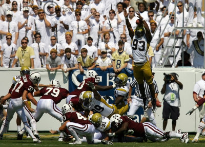 Yellow Jackets DE Johnson leaps to block a field goal attempt by MSU K Adam Carlson