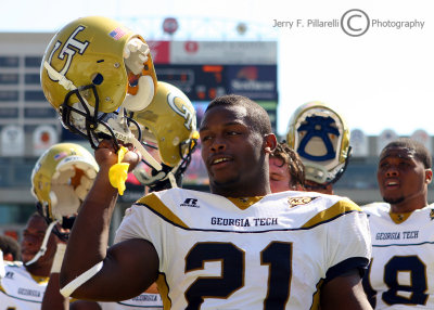 Jackets B-back Jonathan Dwyer celebrates with his team and the fans after defeating Mississippi State