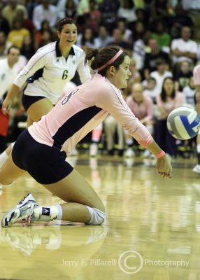 Jackets OH Campbell goes to one knee to receive a serve