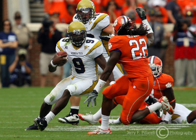 Yellow Jackets QB Nesbitt cuts back in an attempt to avoid Tigers S Chris Clemons