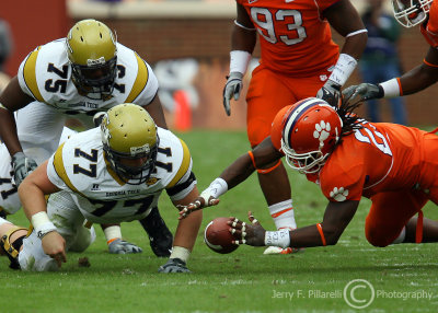 GT OL Dan Voss and OT Nick Claytor scramble for a fumble eventually recovered by CU LB Brandon Maye