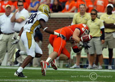 Jackets CB Dominique Reese disrupts Tigers WR Kyle Johnson who drops the pass