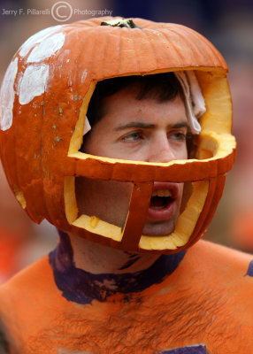Tigers fan cheers his team on through his pumpkin helmet