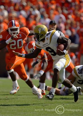 Tech QB Nesbitt heads down field as Clemson LB Maye attempts to head him off