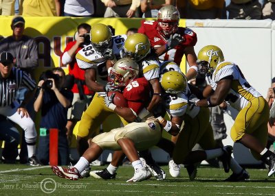 Yellow Jackets defenders collapse on Seminoles FB Marcus Sims stopping him short of the goal line