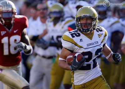 Tech S Cooper Taylor races downfield after intercepting an FSU pass