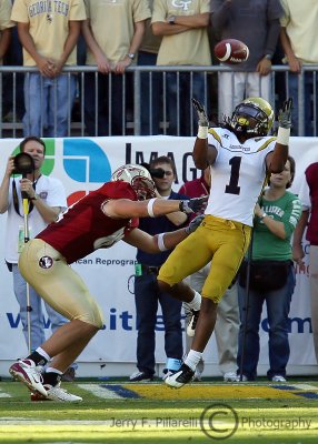 Yellow Jackets S Morgan Burnett attempts to make an interception in the end zone over FSU TE Caz Piurowski...