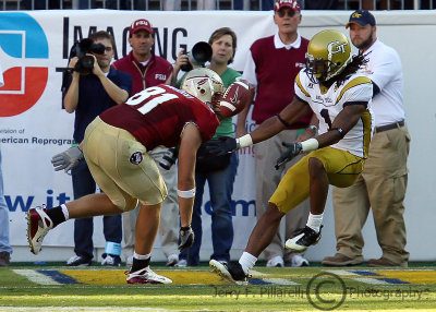 ...GT S Burnett is unable to hang on to a possible interception over FSU TE Piurowski