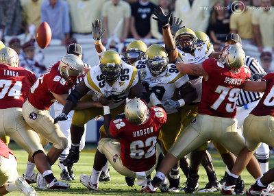 Georgia Tech defensive front surges over the FSU offensive line in an effort to block a field goal attempt