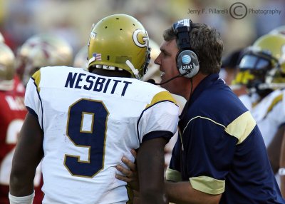Yellow Jackets Head Coach Johnson gives the play to his QB Nesbitt before he takes the field