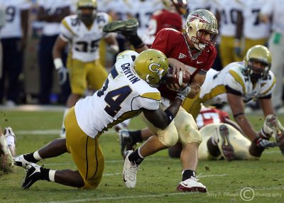 Georgia Tech LB Griffin tries to pry the ball away from Florida St. QB Ponder as he gets the sack
