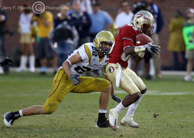 Yellow Jackets S Taylor closes in on Seminoles WR Bert Reed as he makes a catch late in the fourth quarter