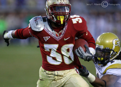 …Tech S Burnett attempts to hold on to FSU RB Thomas after a fourth quarter gain