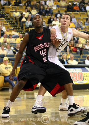 Georgia Tech C Sheehan squares off under the basket with Winston-Salem State F Alcius