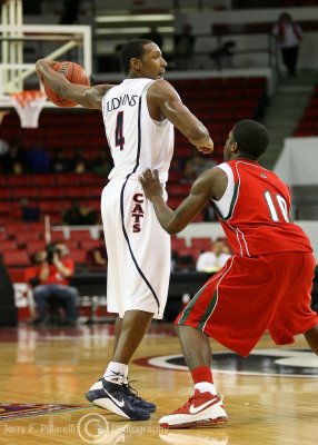 Wildcats G Garland Judkins is defended at the point by Devils G Julius Cheeks